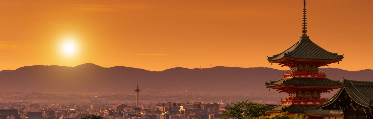 Kiyomizudera shrine in the foreground, Kyoto cityscape at dusk